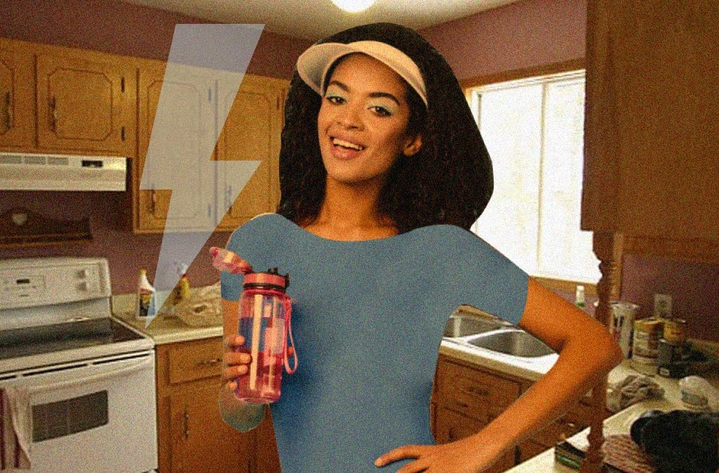 Person in a workout outfit standing in their kitchen with an overall retro/80s look